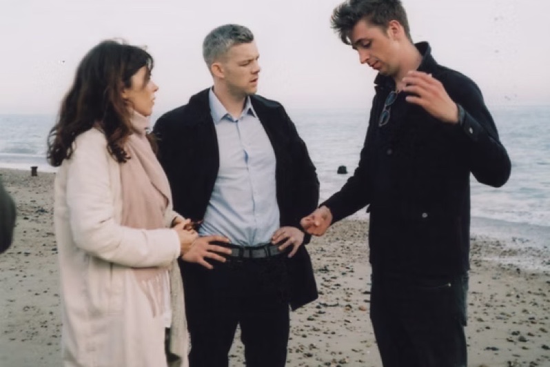 Cameron Richards directing on a beach location.