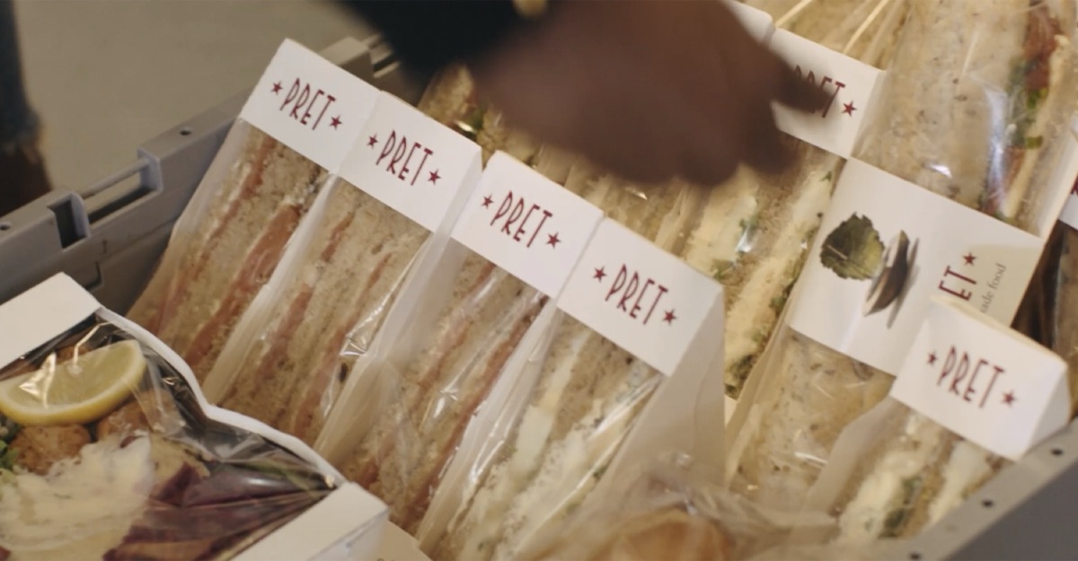 Still from the Pret Foundation World Homeless Day film: a tray of Pret sandwiches being handed out.